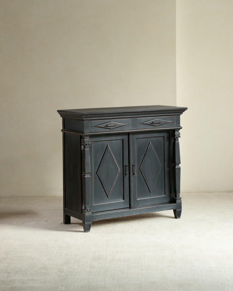 Victoria Teak Cabinet in dark vintage finish with two drawers, carved doors, and brass handles