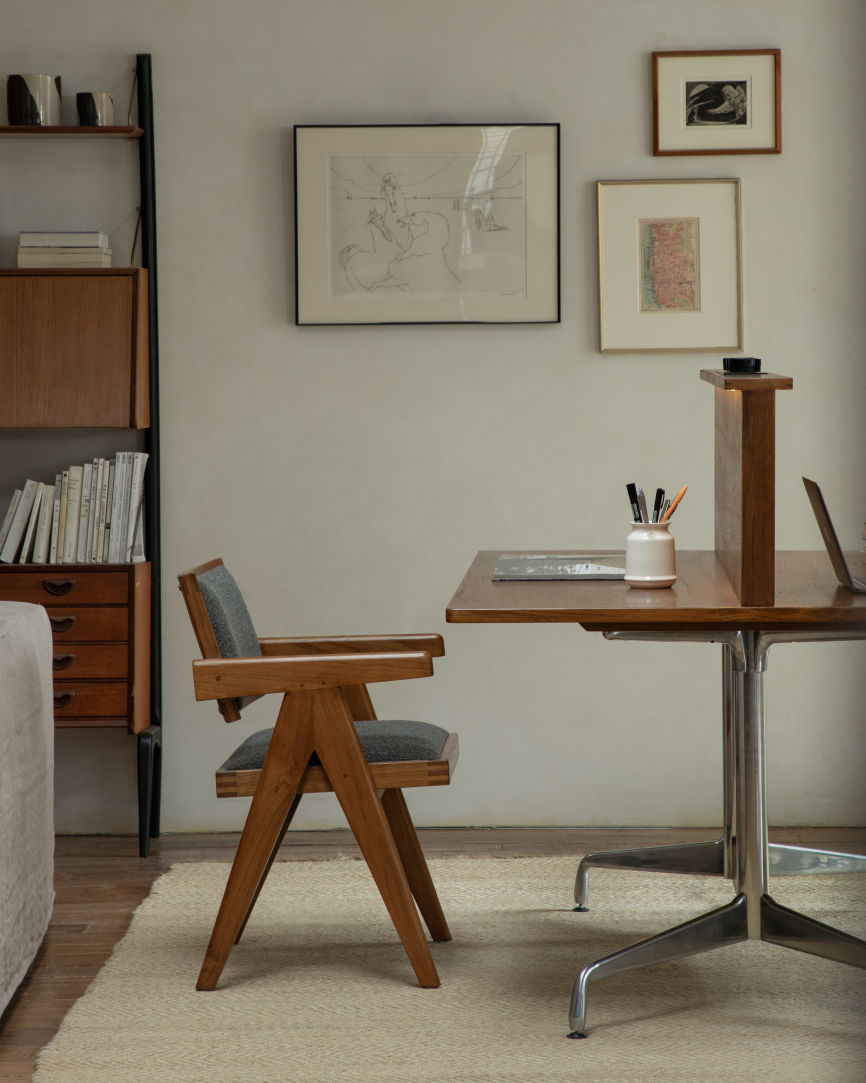 Evan Office Desk with teak top, aluminum legs, and wooden office chair in a stylish workspace with framed art.