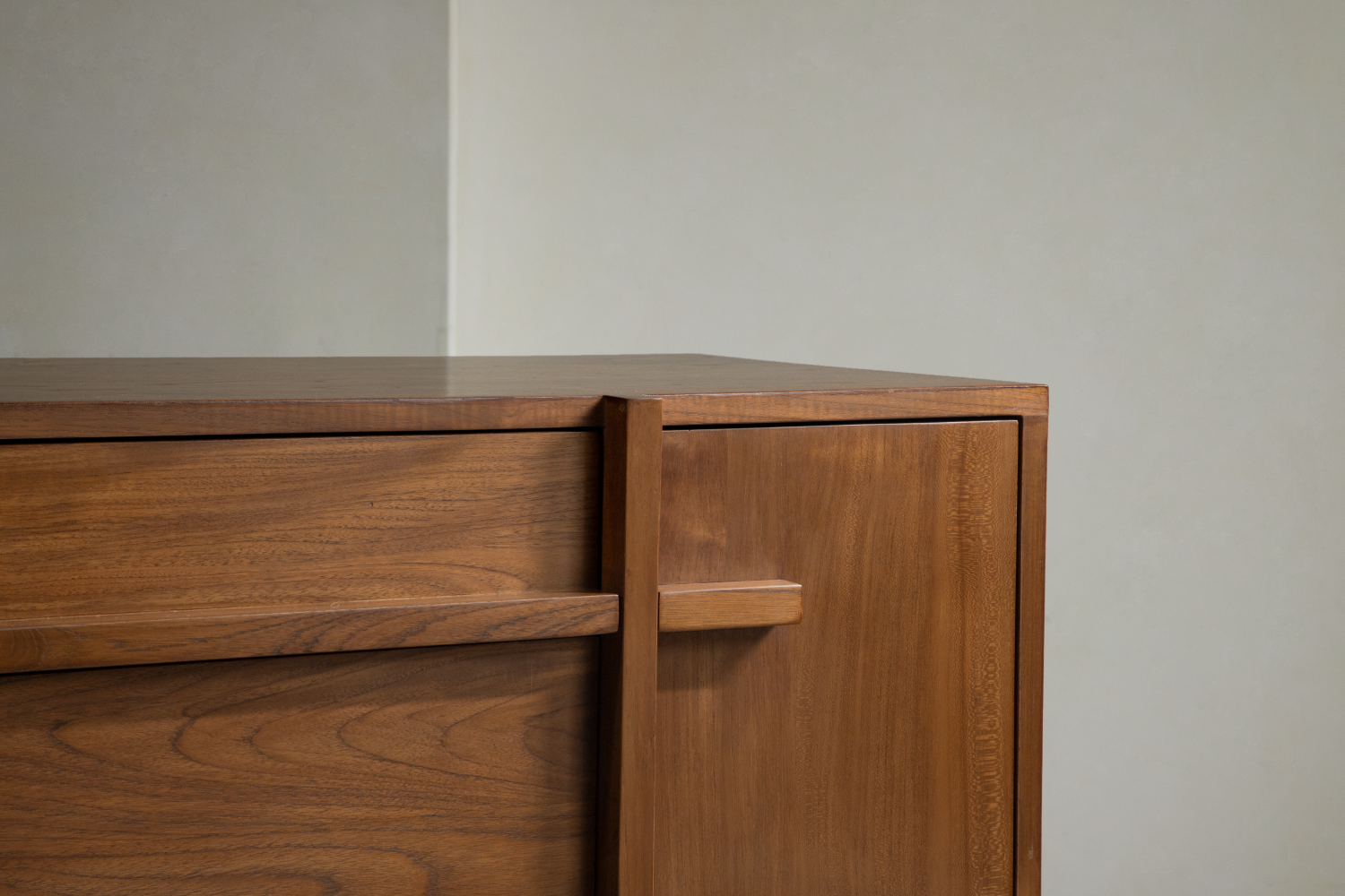 Detail of NO.42 Teak Sideboard showing rich wood grain, drawer, and modern handle.