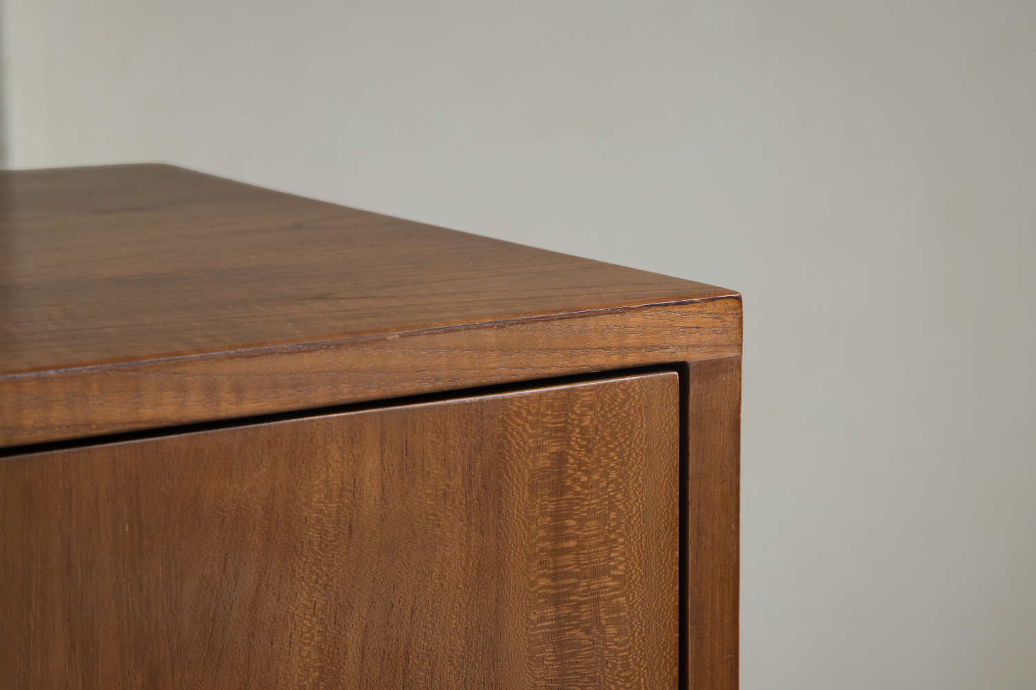NO.42 Sideboard: Detailed view of warm teak wood grain and precise joinery on the drawer front.