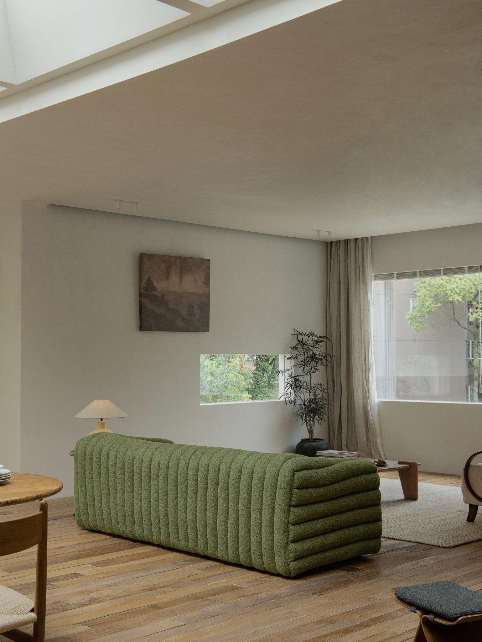 Miche Sofa in green with vertical ribbed design, accentuates cozy living space with comfortable style