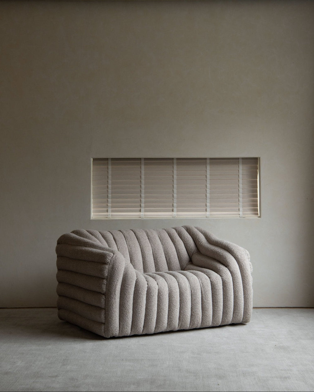 Miche Sofa in beige with vertical ribbed design in a modern living room