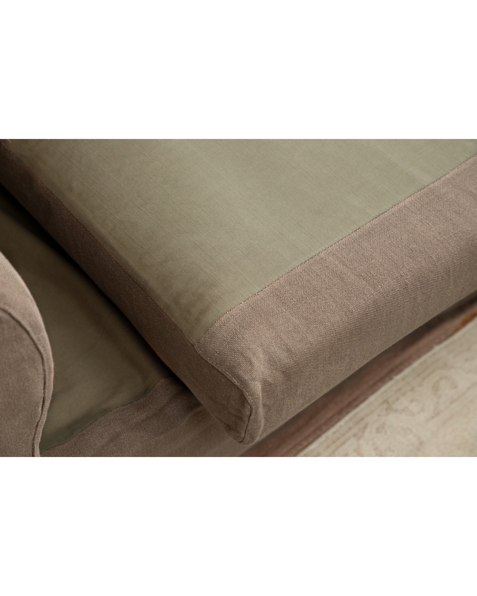 Charlotte Sofa: close-up of textured woven linen fabric in muted green and brown.