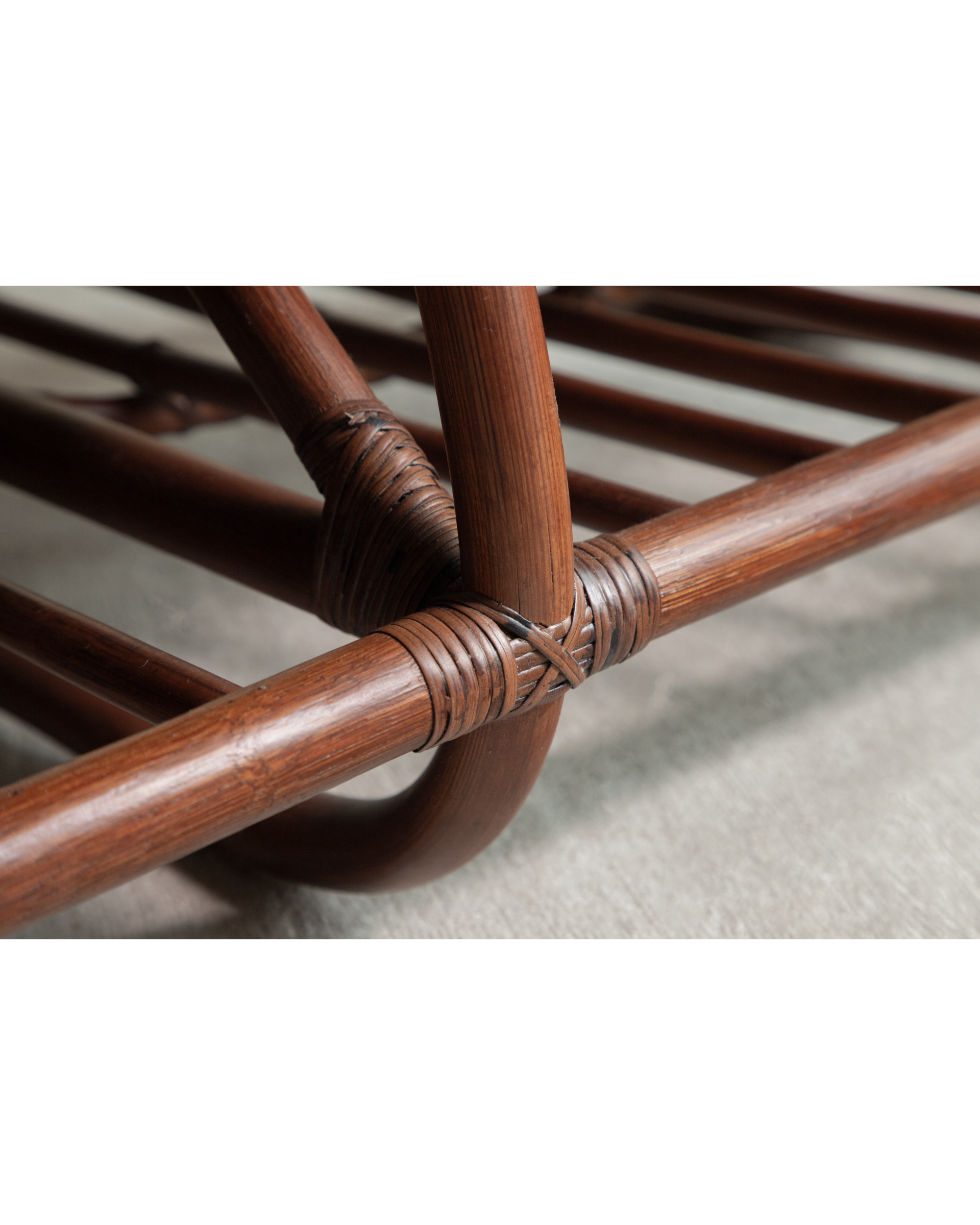 Detail of the intricate rattan frame joinery on the Twyla Storage Bench.