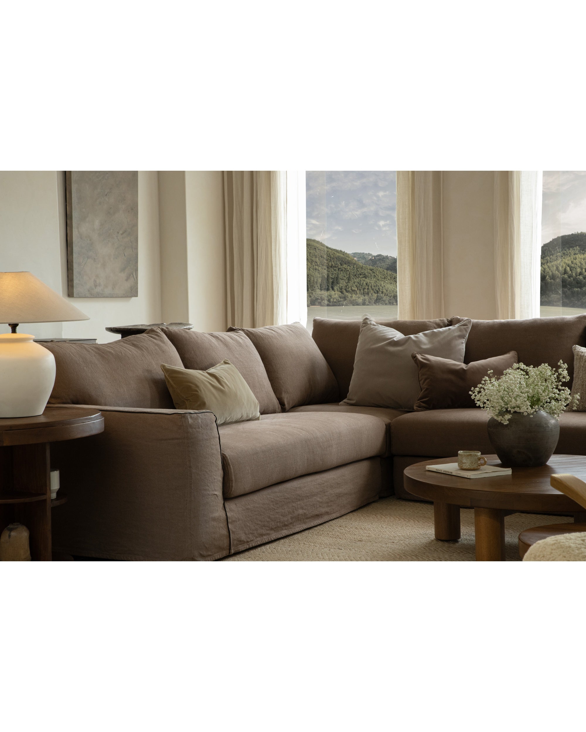 Noa sectional sofa in taupe Belgian linen, modular design with plush cushions.