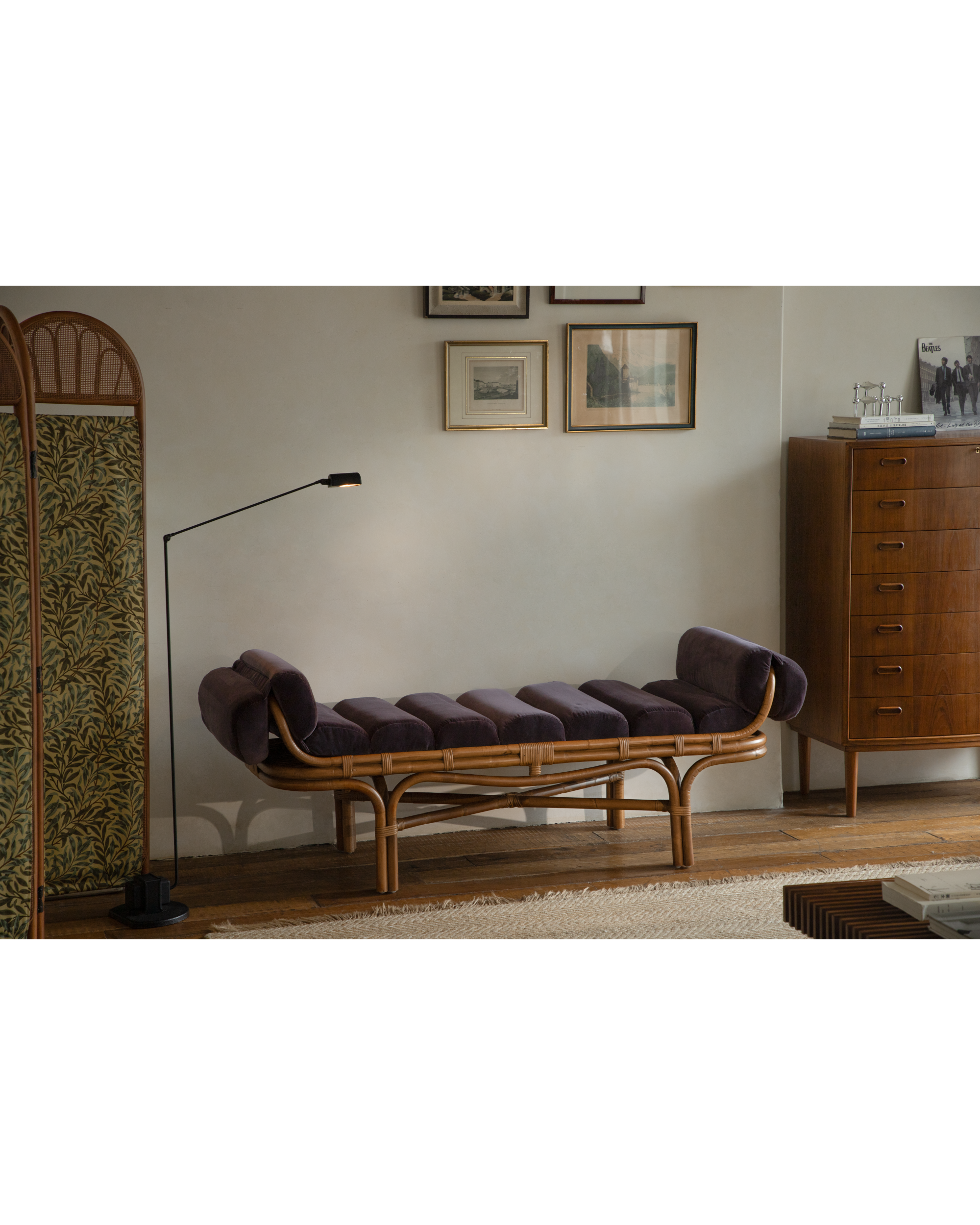 Bridget Bench with curved rattan frame and plush deep purple velvet cushions.