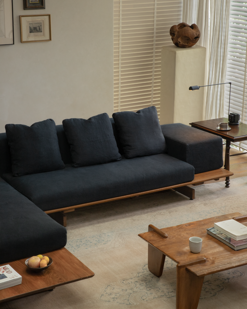 Black Tatami linen modular sofa with teak wood base, deep cushions, modular design.