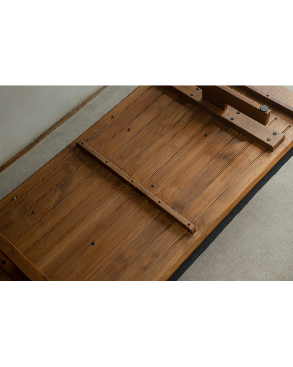 Underside view of Tatami Linen Modular Sofa showing teak wood plank construction