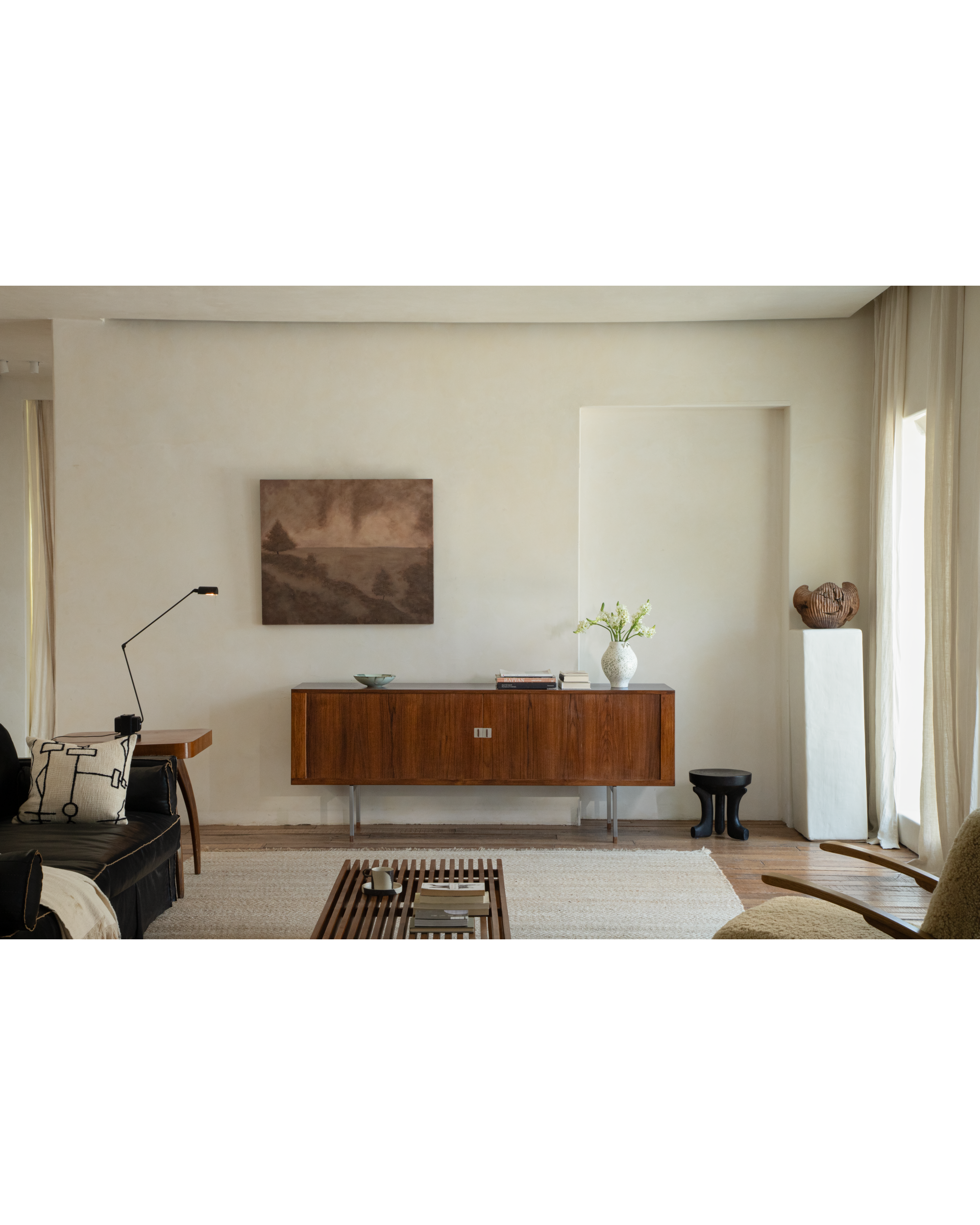 Mid-century Martin Credenza in solid teak with roller shutter doors and stainless steel legs.
