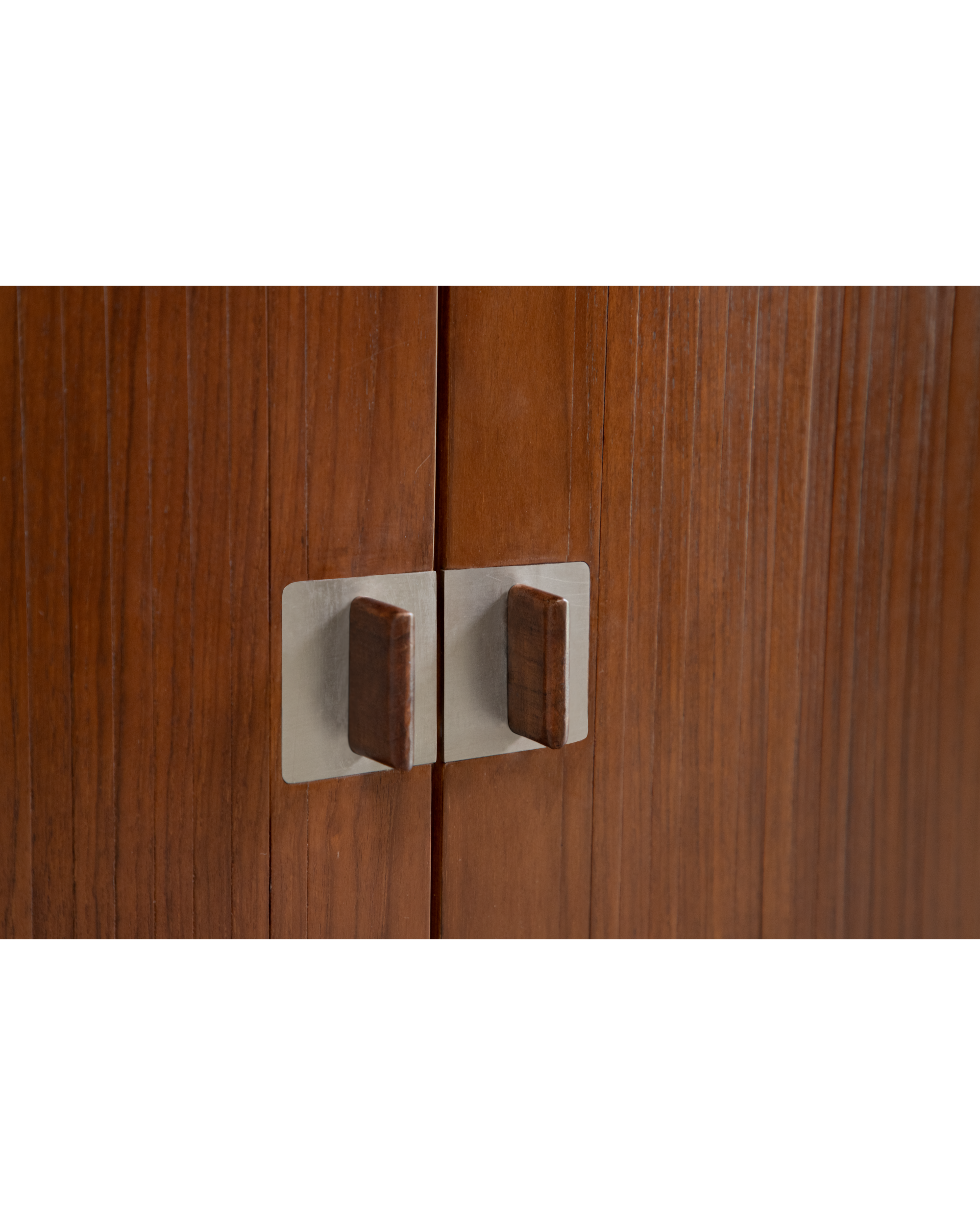 Martin Credenza solid teak doors with mid-century wooden handles on metal plates.
