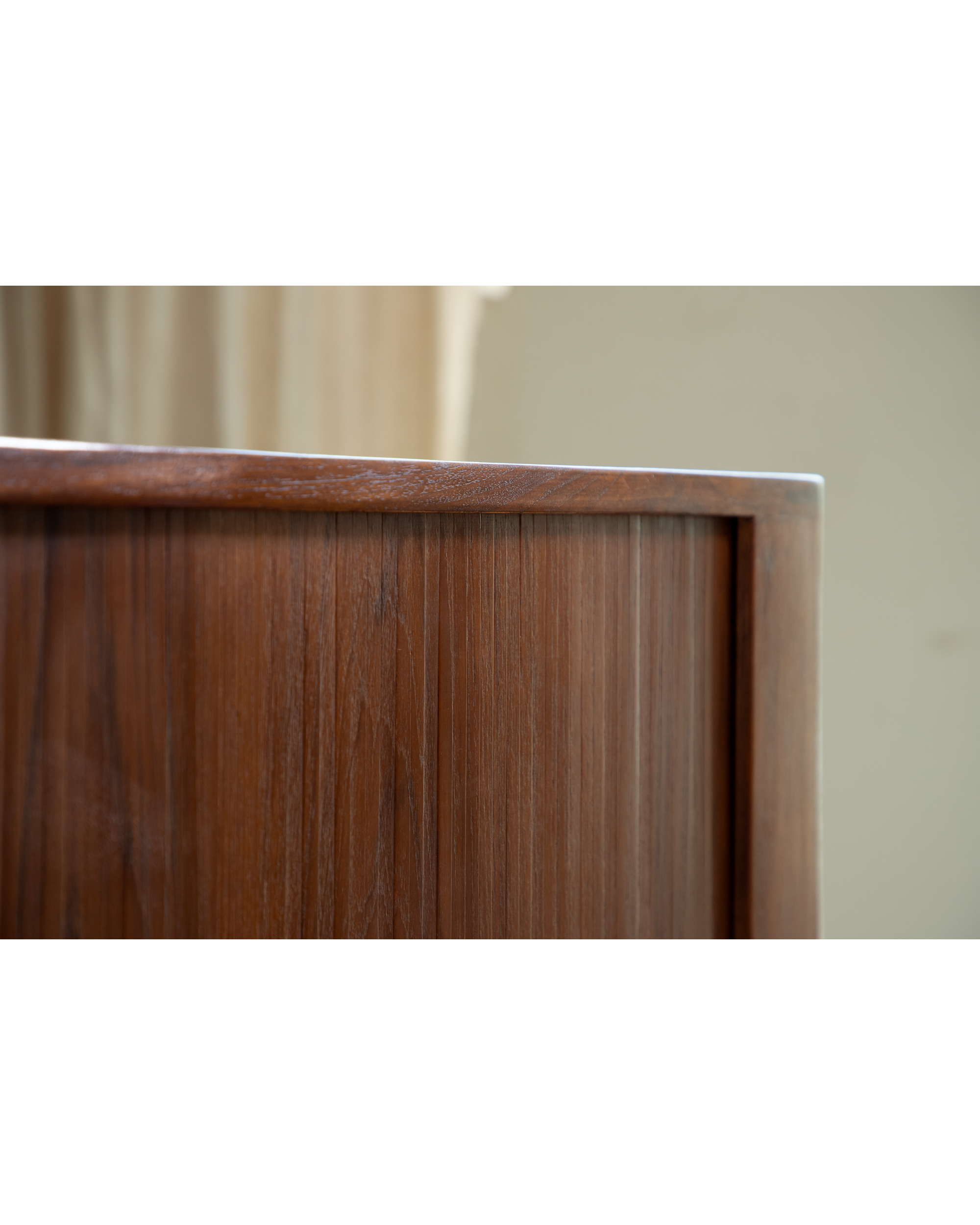Mid-century Martin Credenza detail, showing solid teak roller shutter doors.