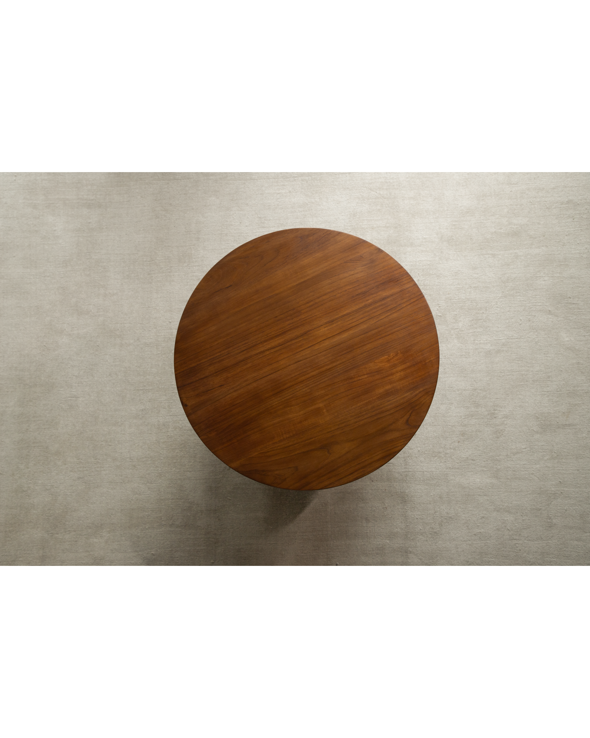 Round Daisy side table in Indonesian teak, top view showing wood grain.