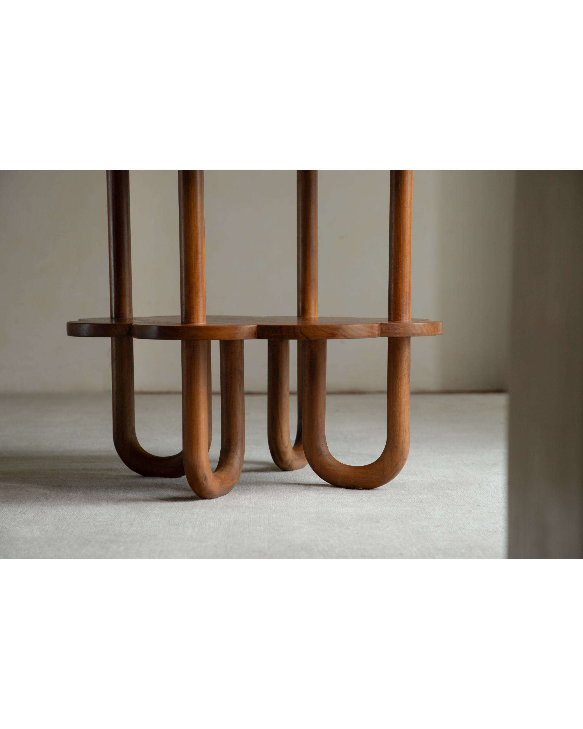 Daisy Side Table with curved teak wood legs and staggered layers.
