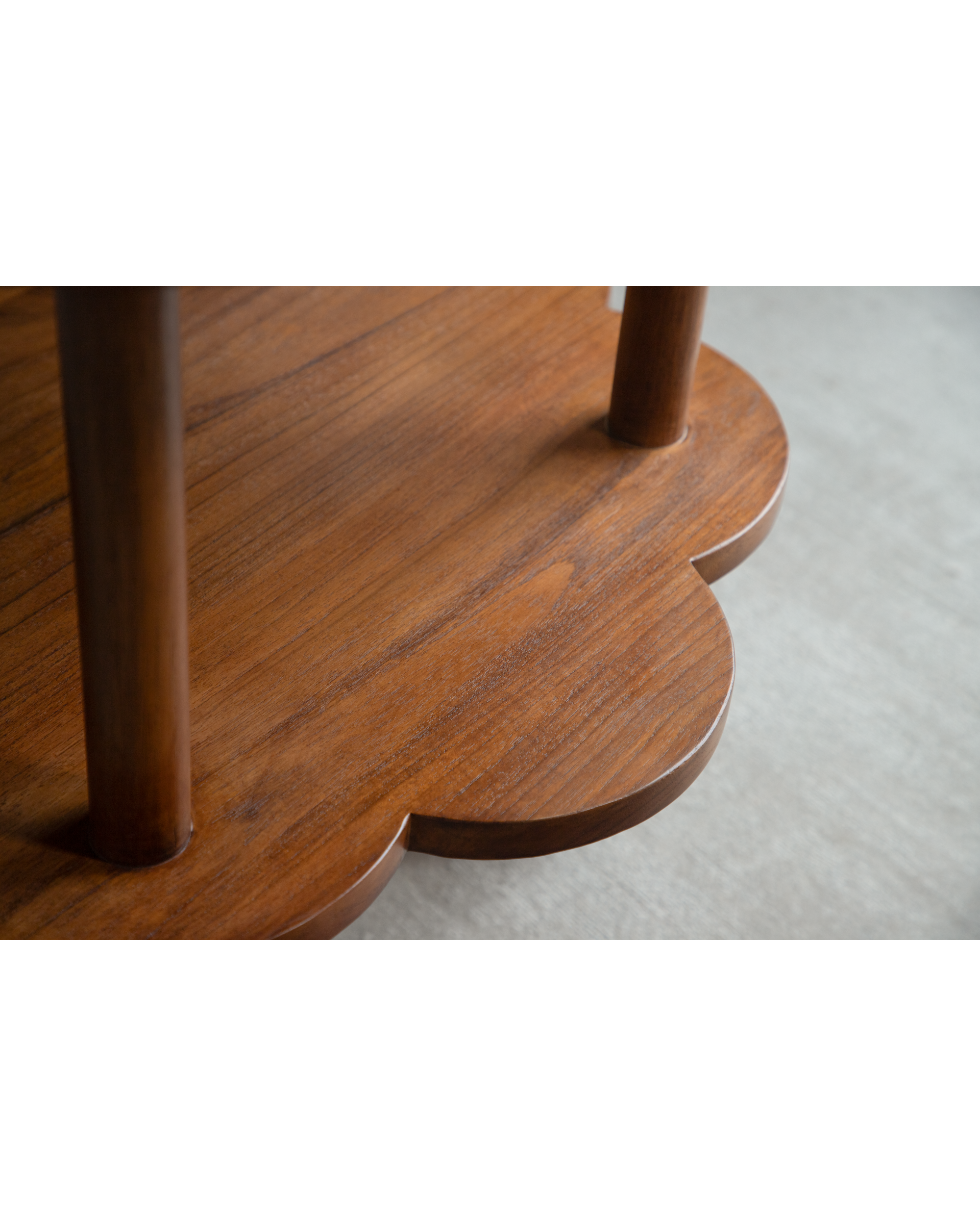Daisy Side Table in warm teak wood with intricate scalloped edge detail.