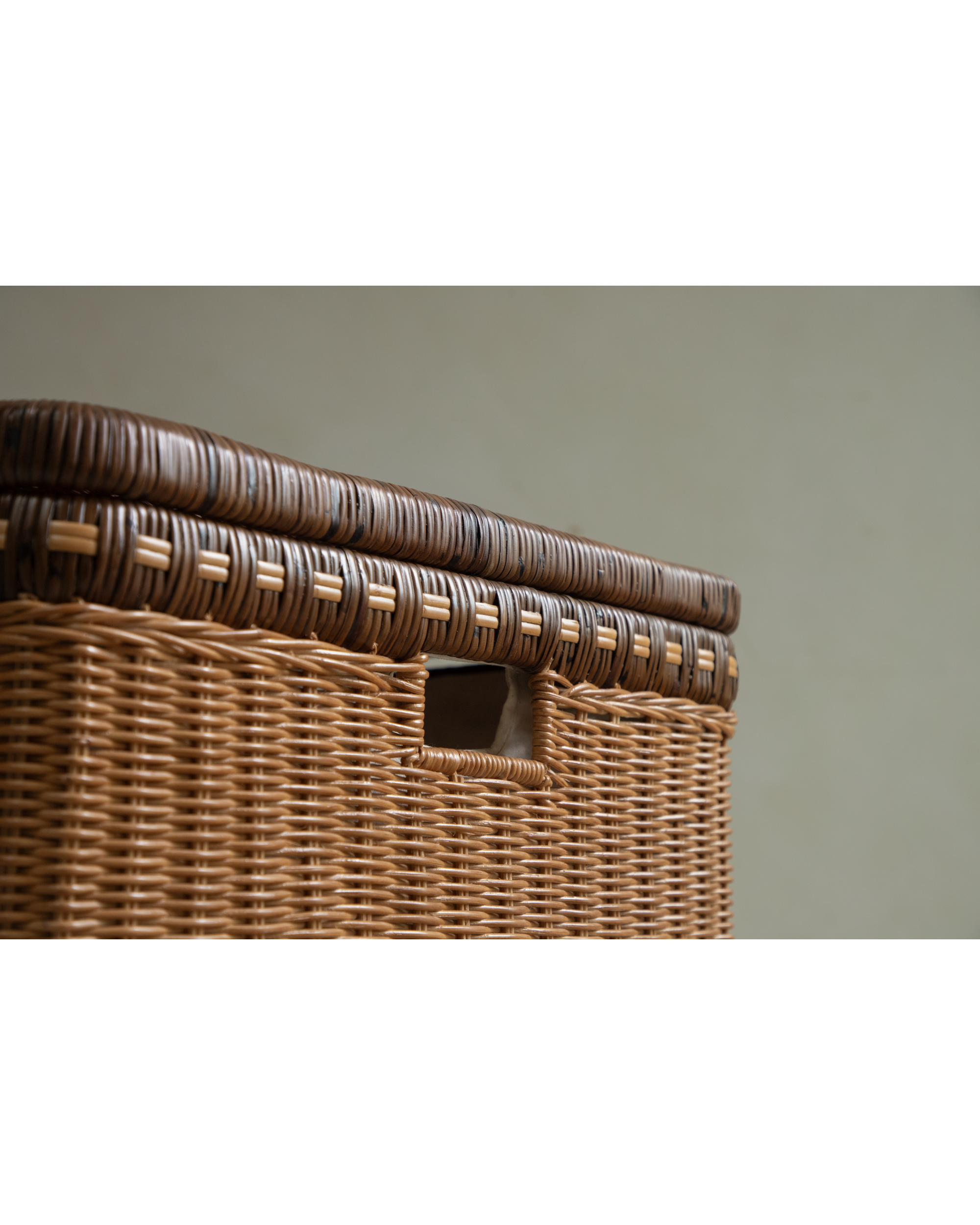 Milo Rattan Laundry Cart: woven natural rattan detail with cutout handle.