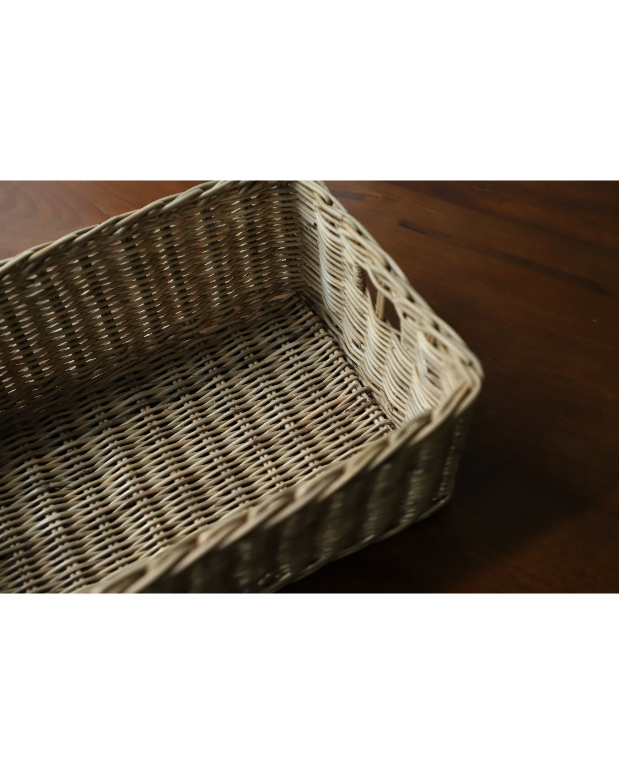 Etta Storage Basket: Hand-woven natural rattan with organic texture and woven detail.