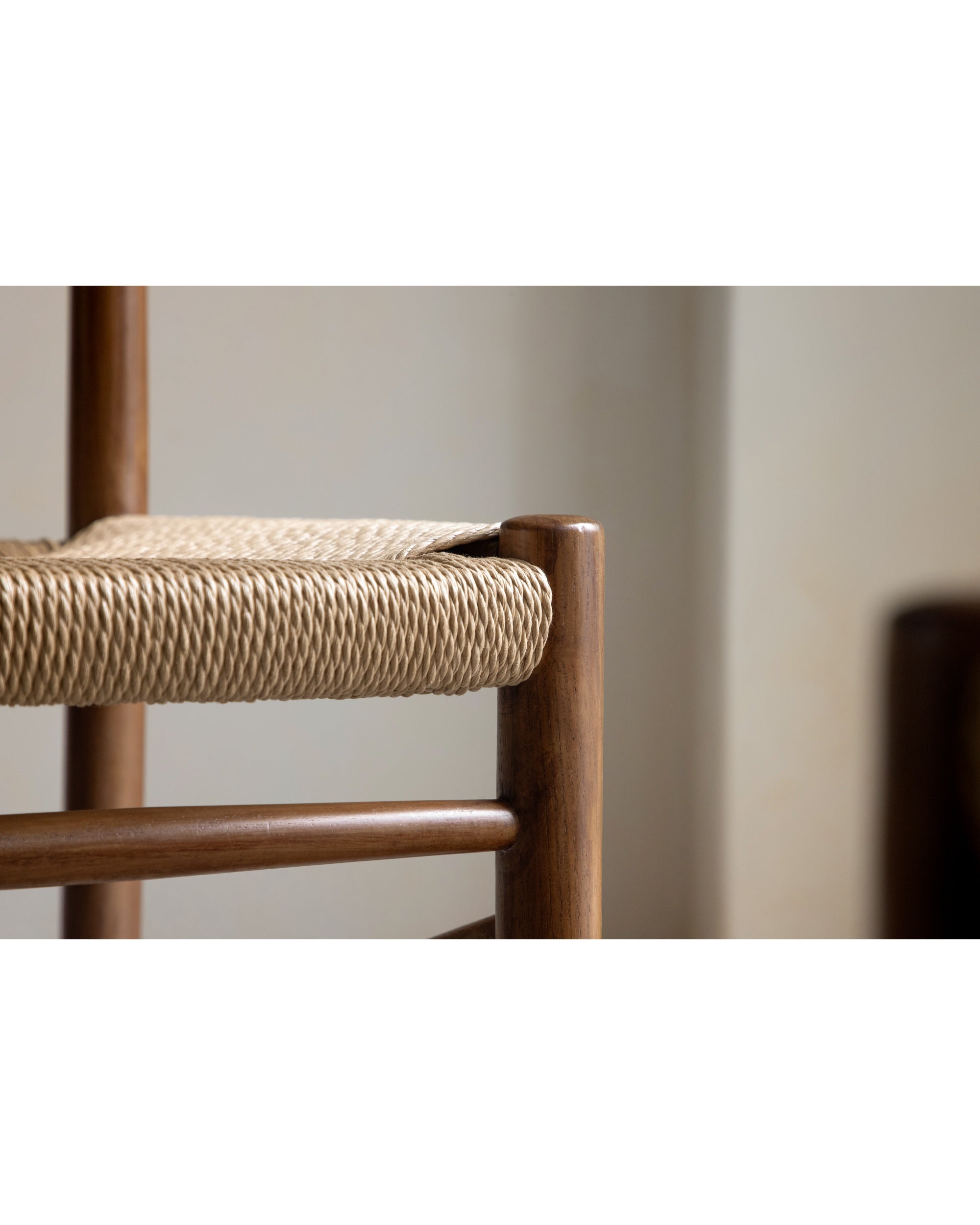 Margaret Dining Chair detail: handwoven rush seat with solid teak wood frame.
