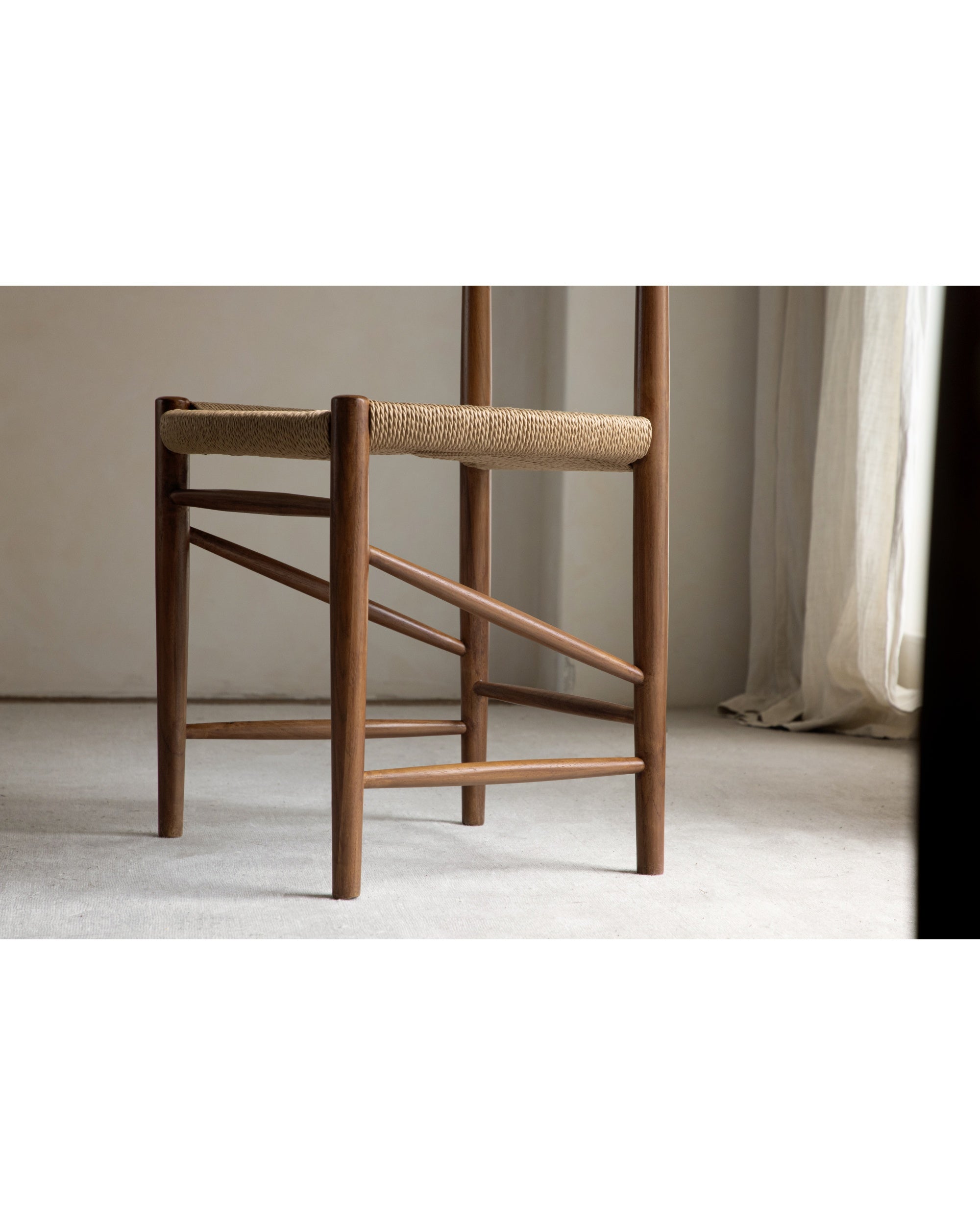 Margaret Dining Chair with woven rush seat and solid teak legs.