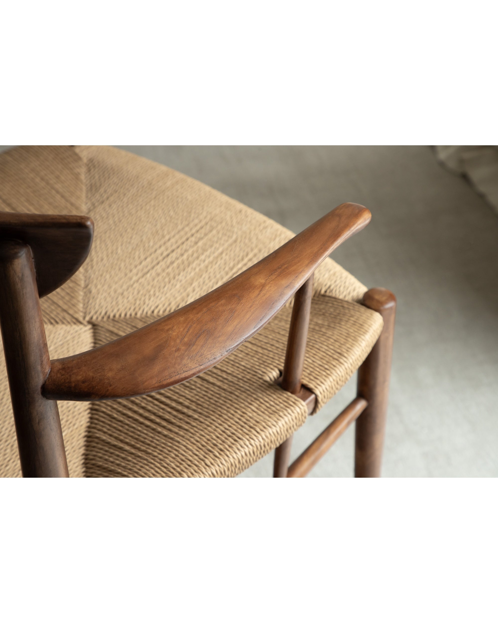 Henrik Dining Chair: woven rush seat and curved dark teak armrest