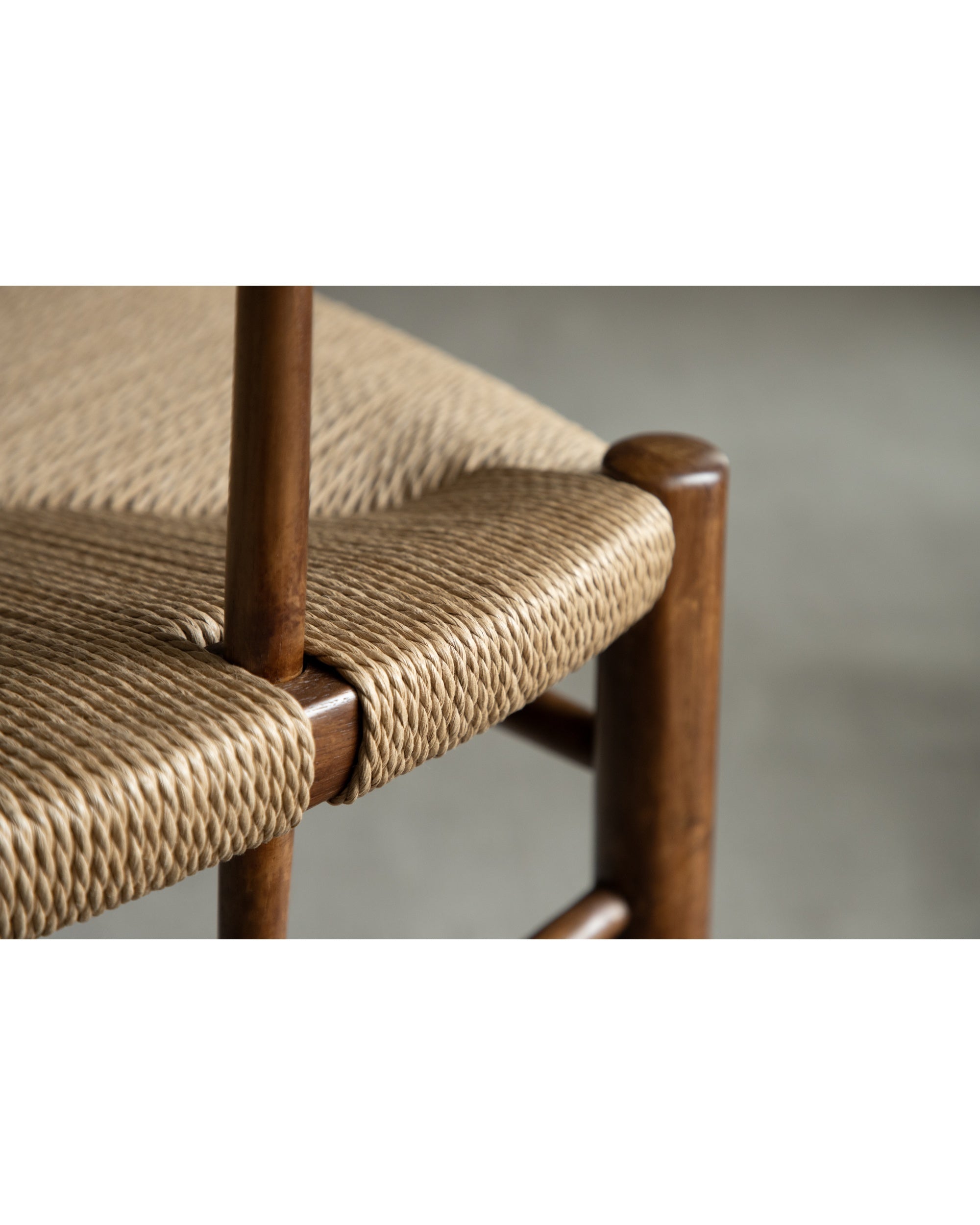 Henrik Dining Chair: woven rush seat detail and solid teak wood frame.