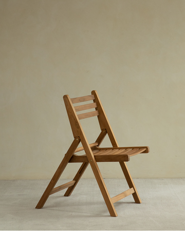 Lambda Outdoor Folding Chair: durable teak wood with slatted seat and back.
