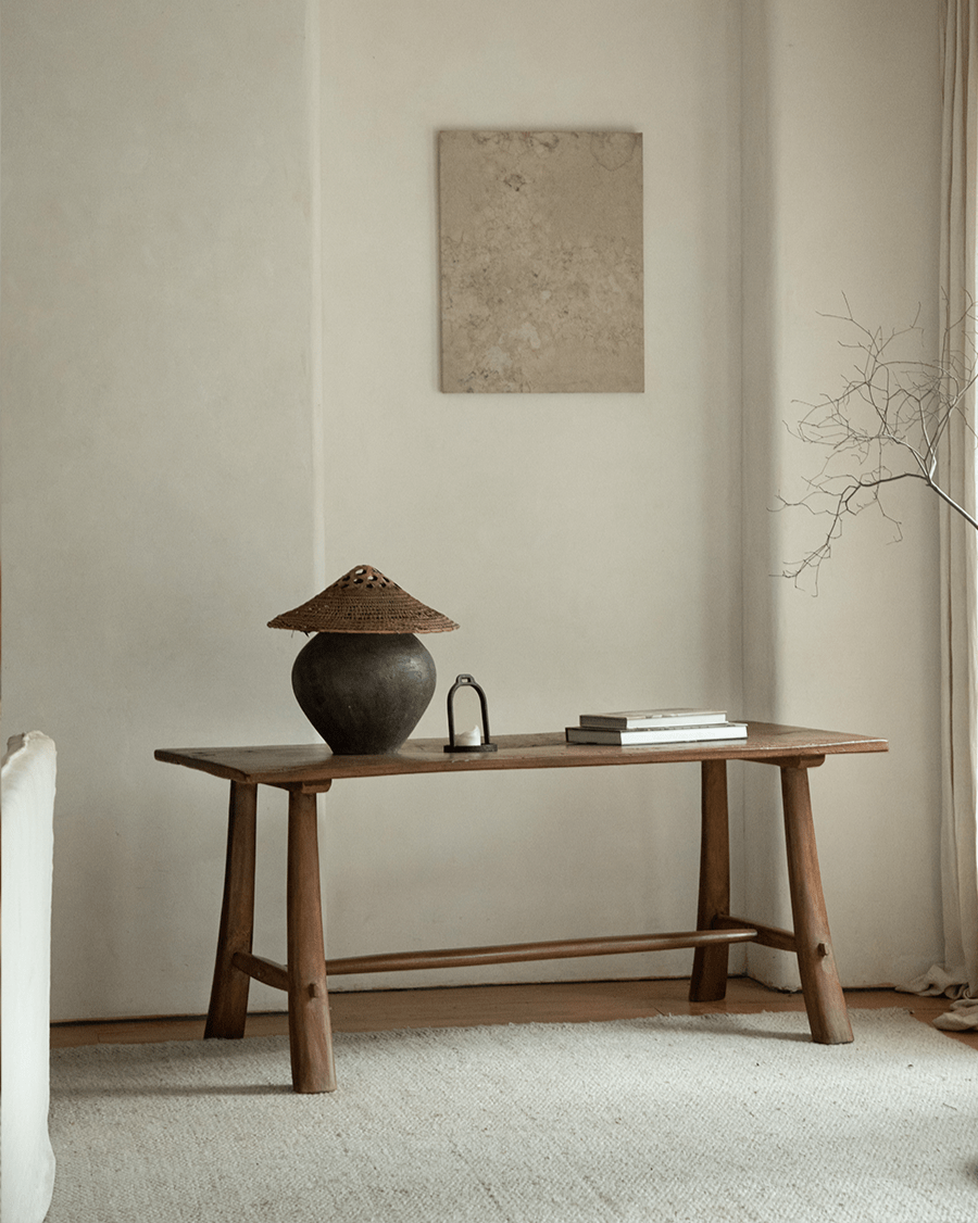Reclaimed wood Branch Desk with rustic decor, natural light, and minimalist design.