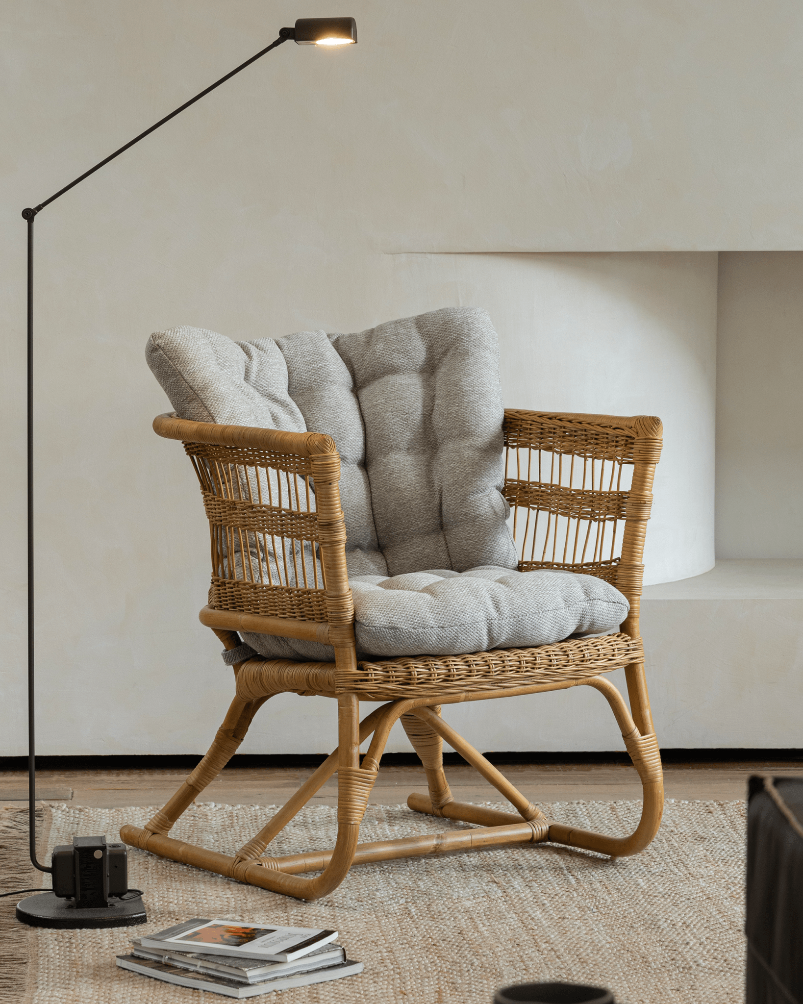 Helian Rattan Chair with gray silk cushion and natural rattan frame, modern design