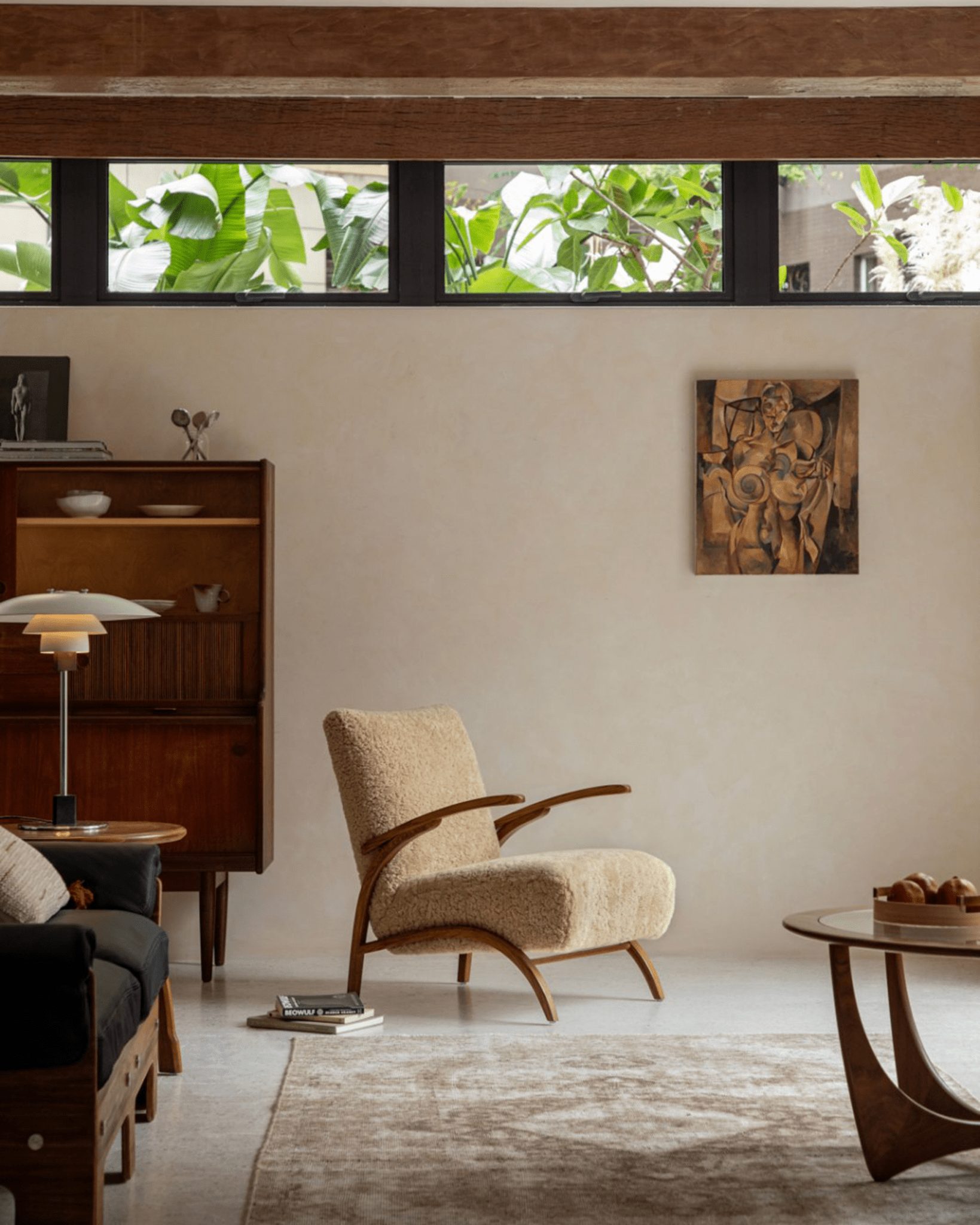 Nebula Lounge Chair in shearling upholstery, mid-century modern living room setting, red oak frame