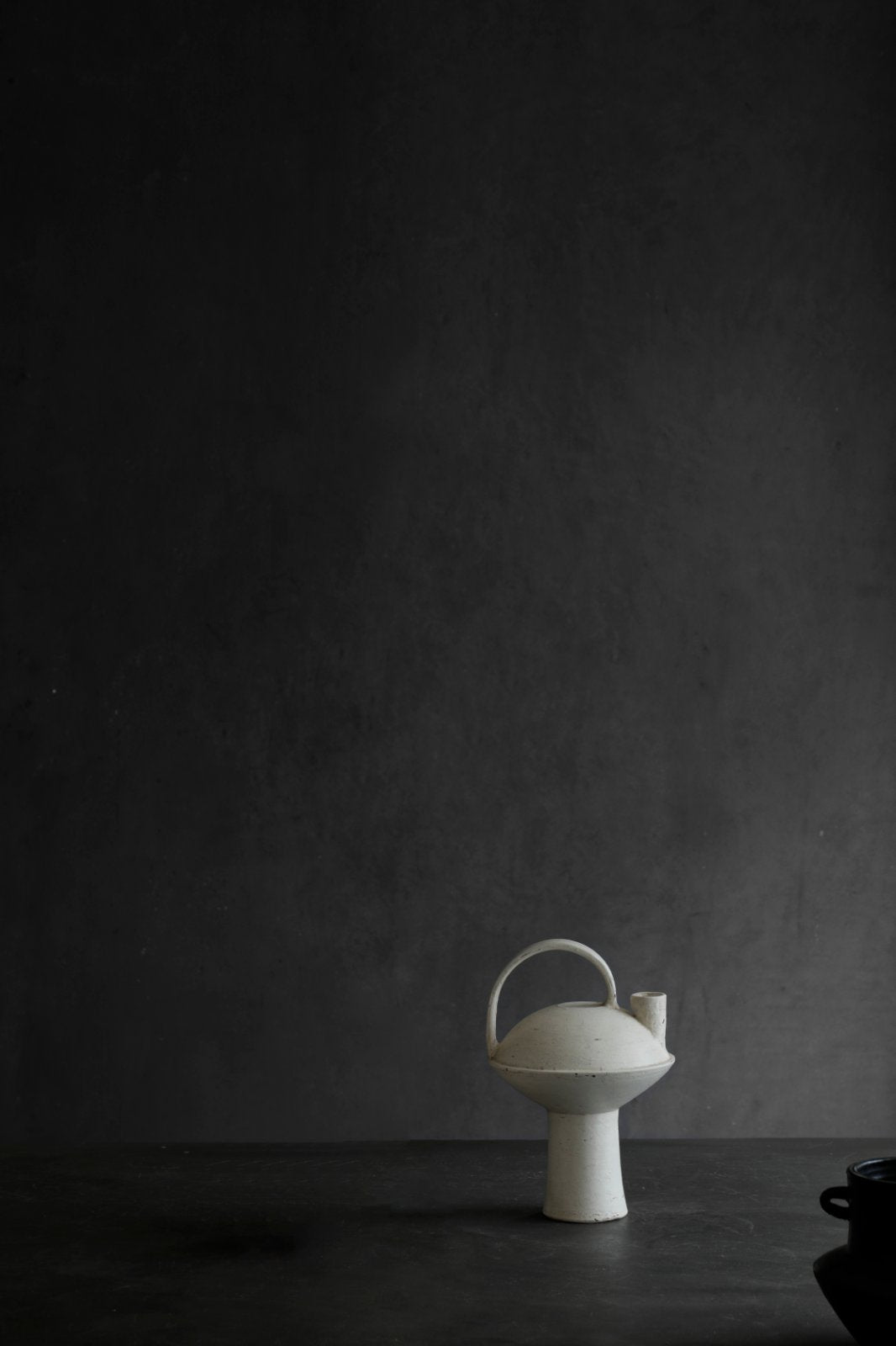 White ceramic vase with handle and spout, minimalist design, perfect for home decor