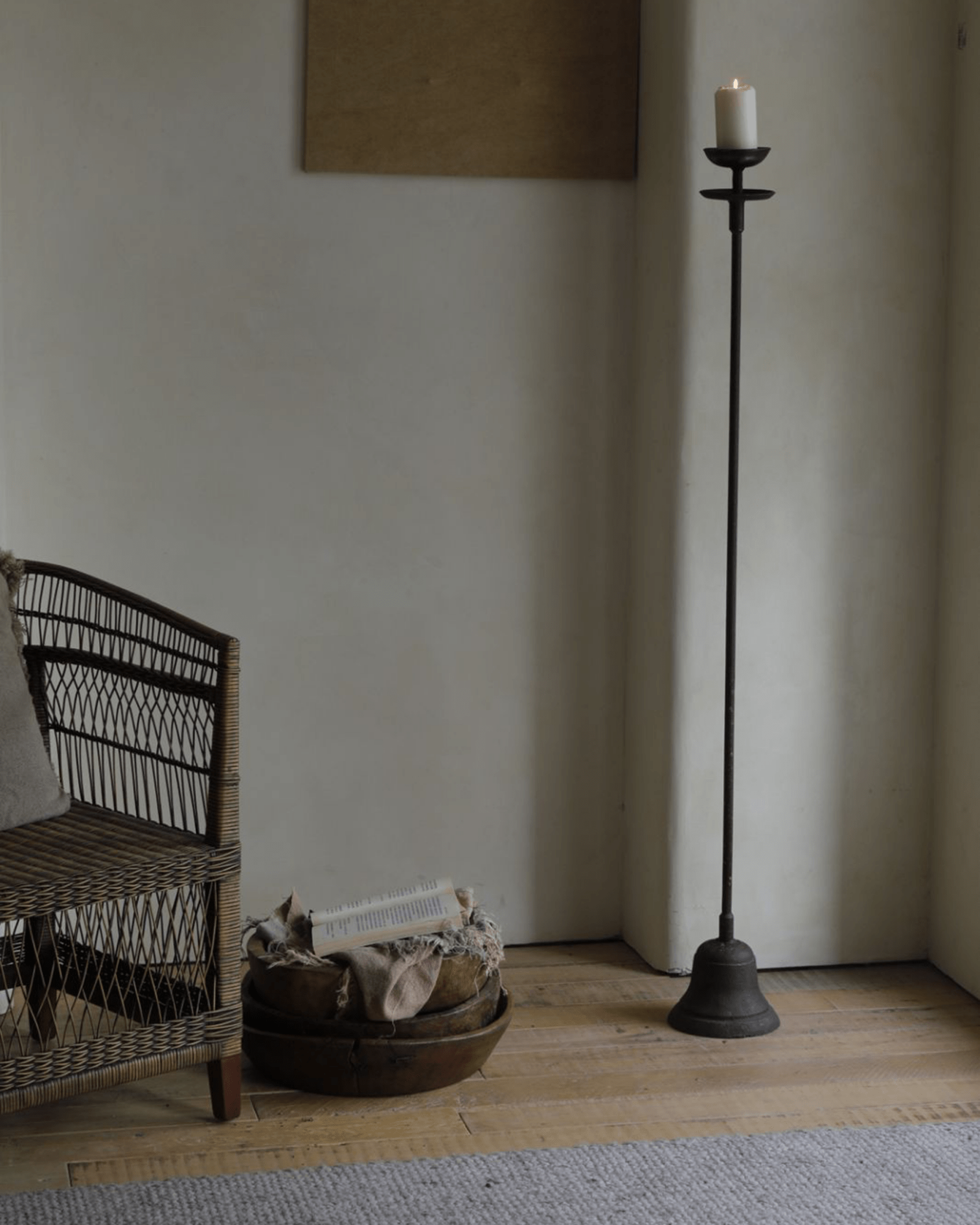 Black iron floor candlestick with lit candle, rustic home decor, perfect for home decoration
