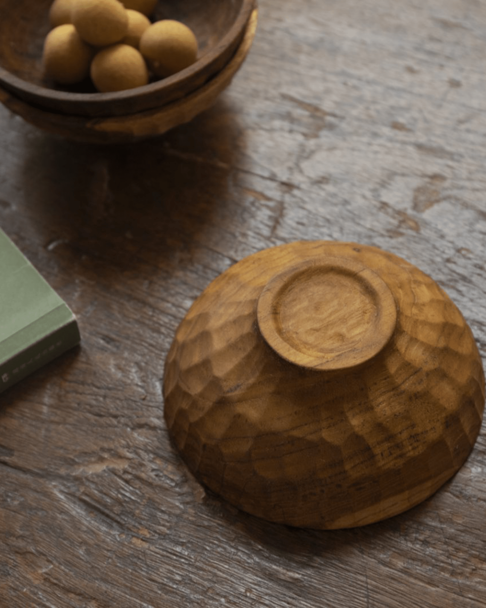 Handmade teak wood double hole cup, carved texture, wooden surface.