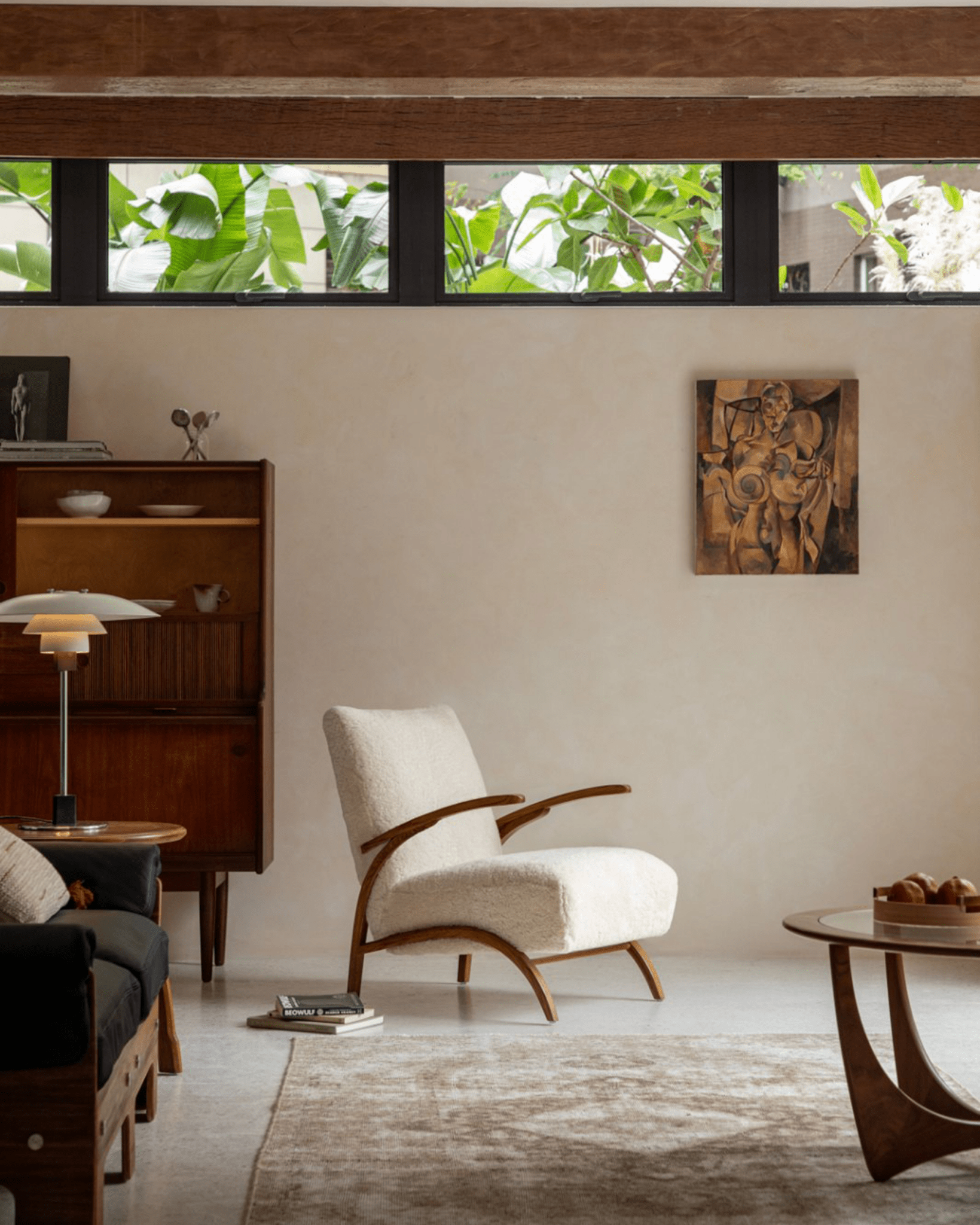 Nebula Lounge Chair in a cozy living room, shearling upholstery, red oak frame, mid-century modern design