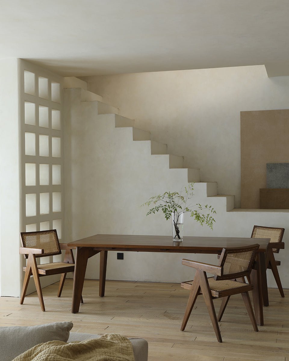 Easy Dining Table in room setting, featuring wooden table and chairs, minimalist design, for dining or work