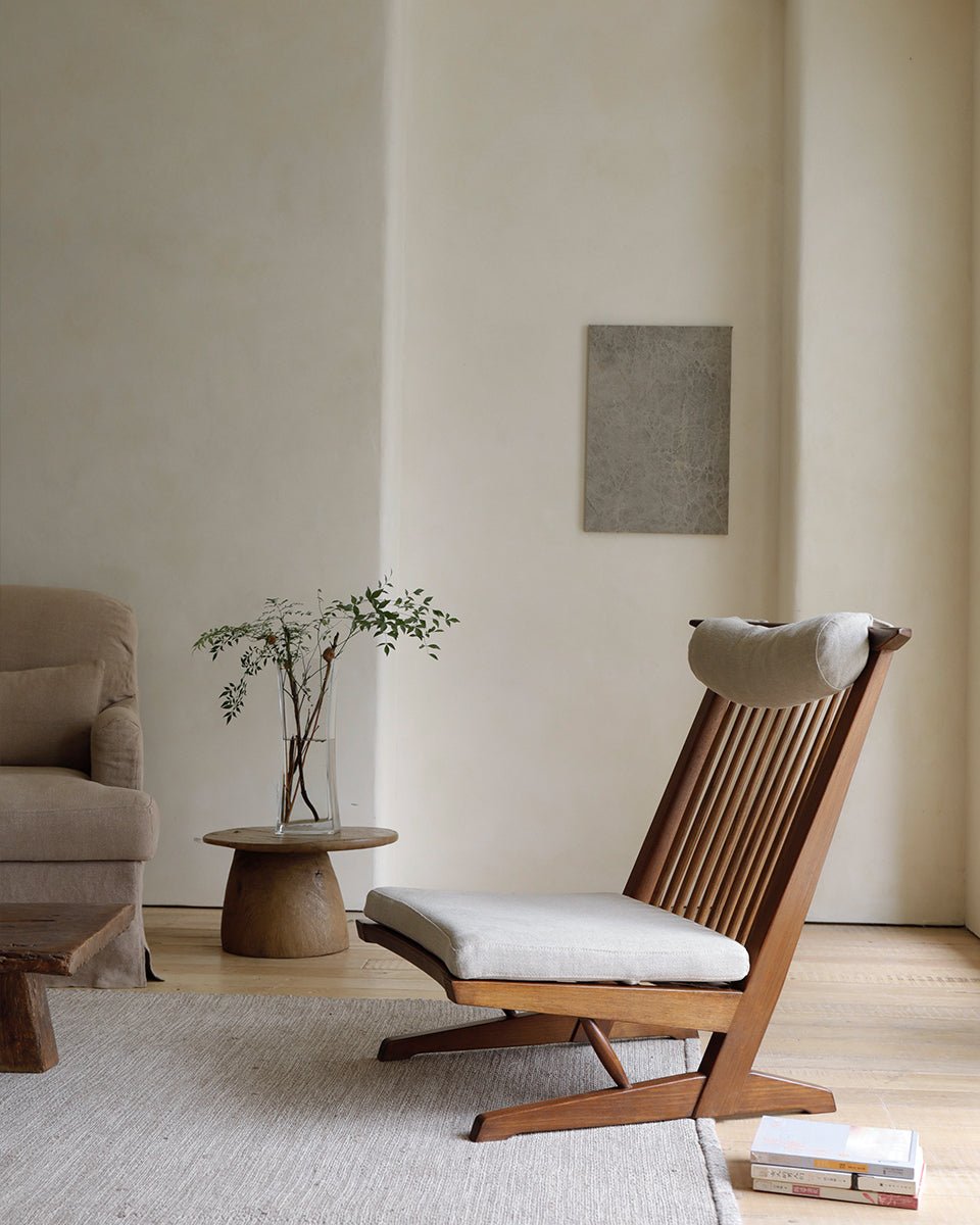 George Lounge Chair crafted from teak wood with a light cushion, ideal for a modern living space