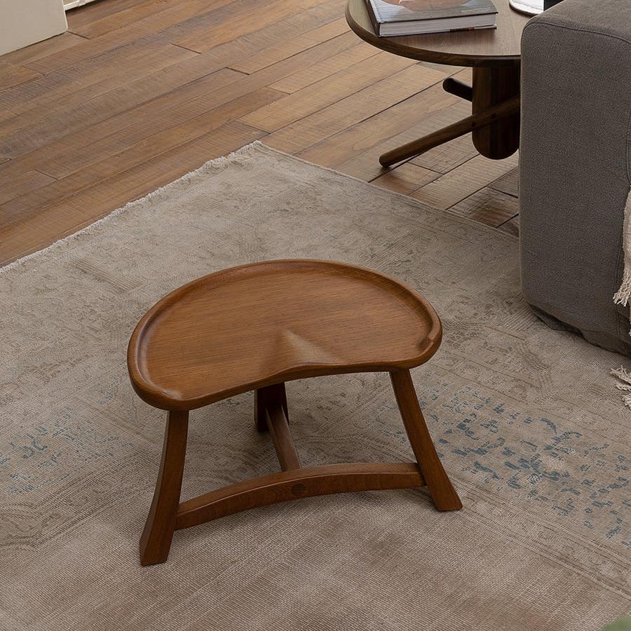Pod Stool in natural wood finish, versatile teak stool perfect for vintage or modern living spaces