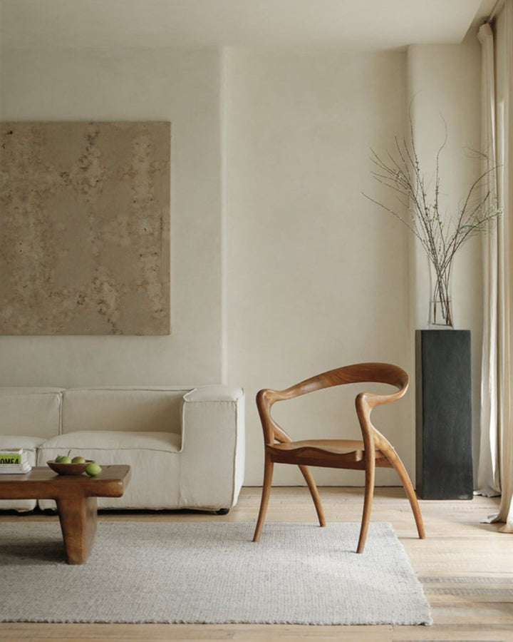 Olivia Chair with elegant curved design in a modern living room