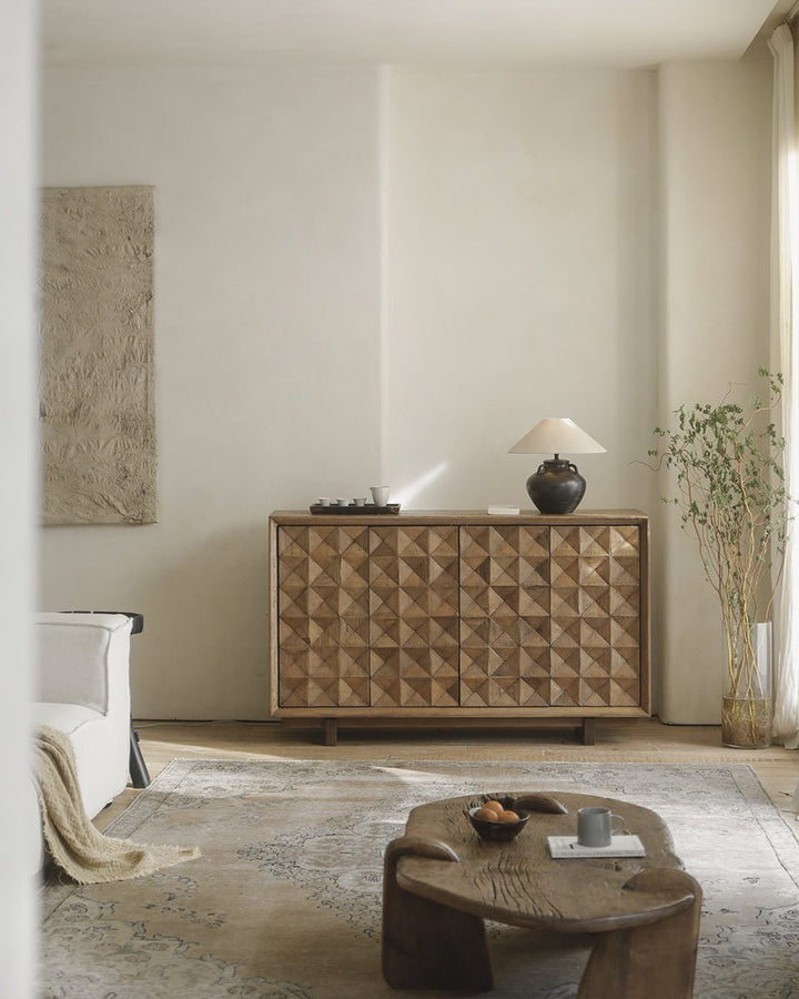 Geometric Bumpy Sideboard with lamp and vase in bright modern living room setting.
