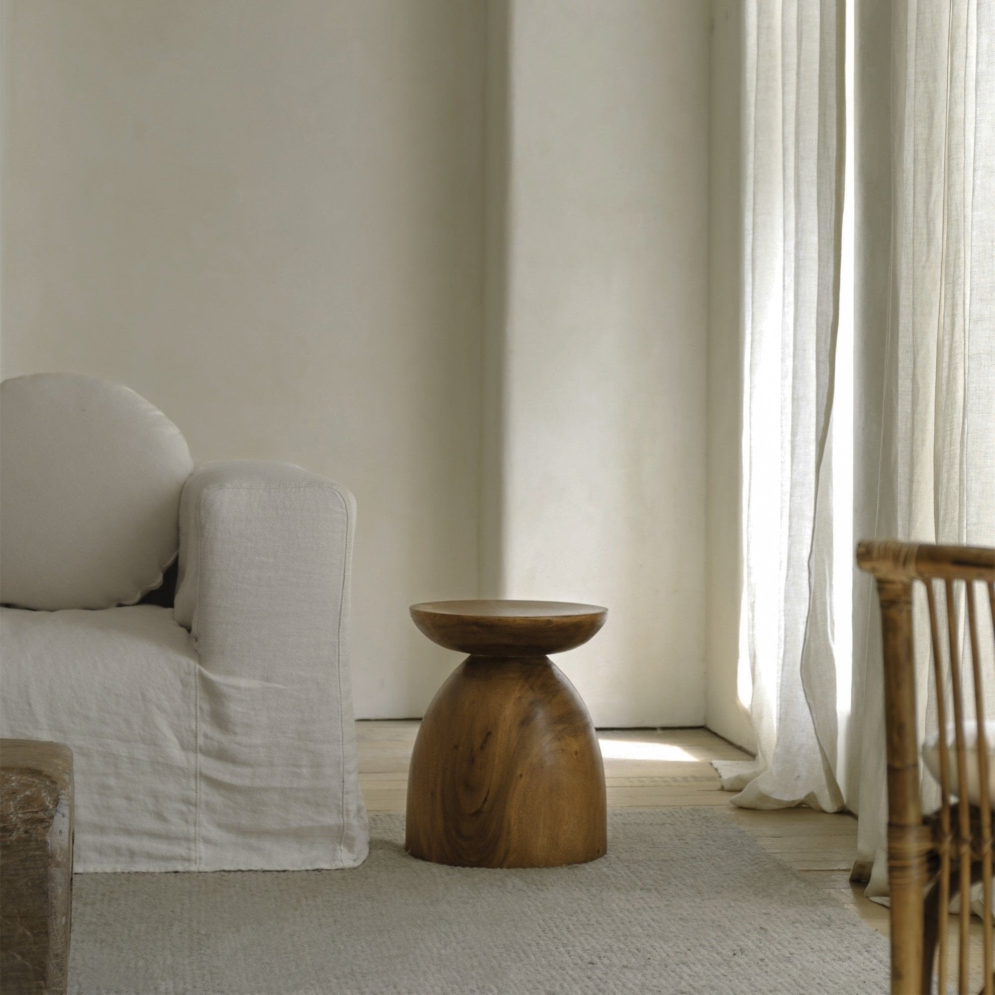 Sandglass table made of Samanea saman, brown wooden accent table, minimalist decor.