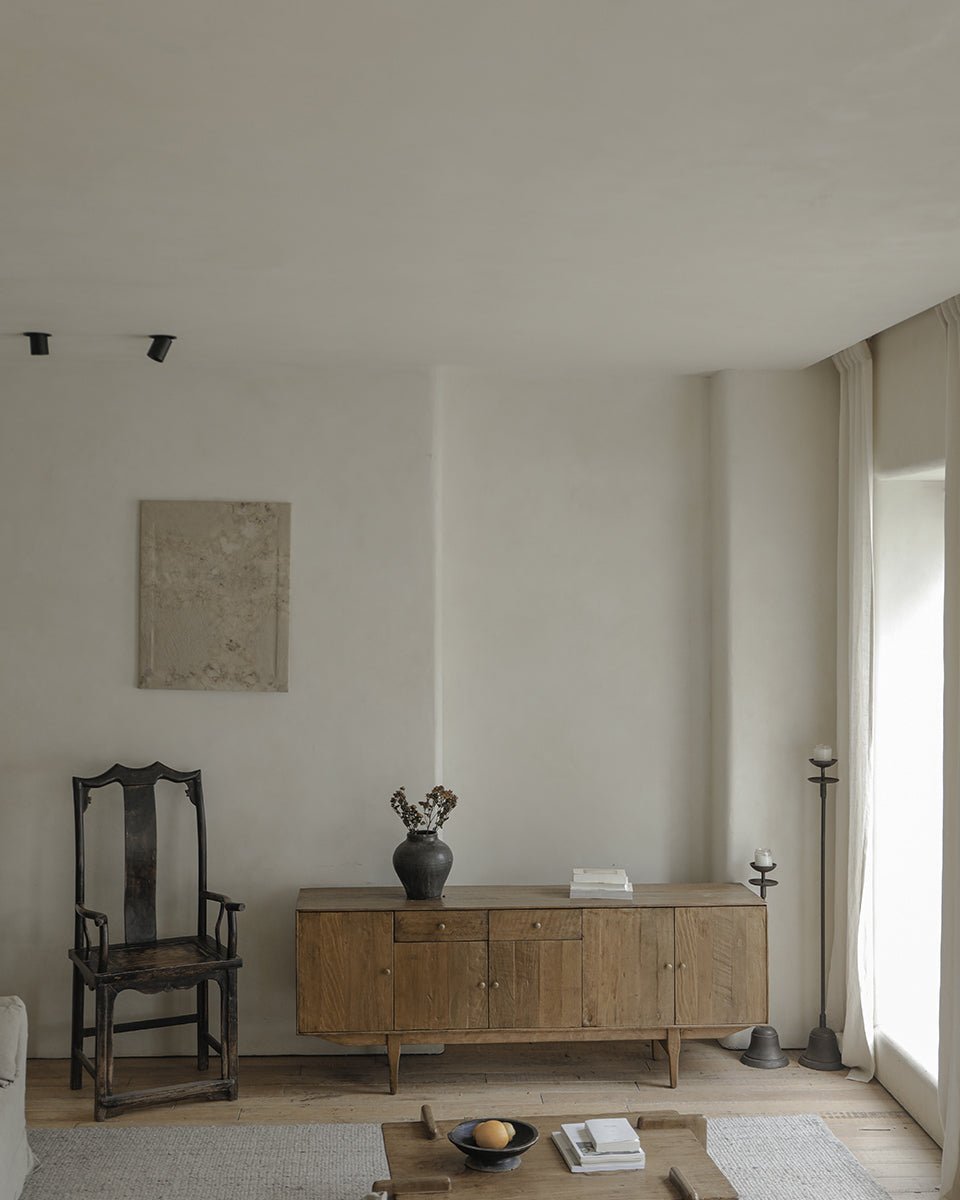 OX Sideboard in a minimalist living room setting, showcasing aged vintage wood, warm feel.