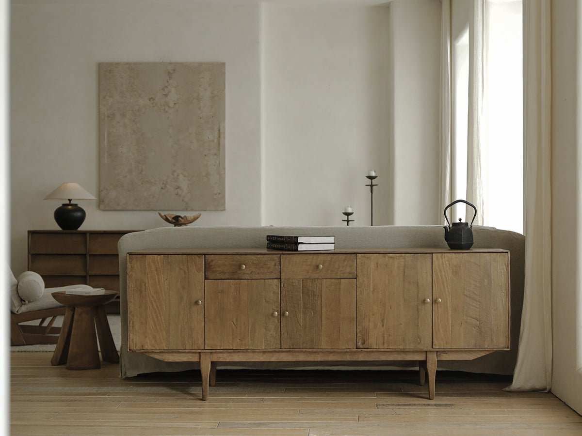 OX Sideboard in a minimalist living room setting with aged vintage wood, brass handles, warm feel.