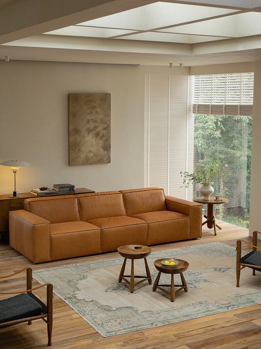 Modern living room with Mocho stools and brown leather sofa
