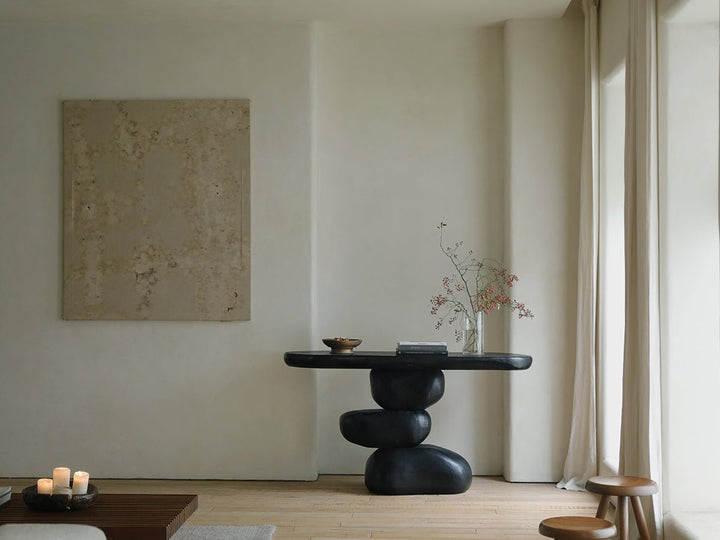 Stylish black console table with rounded edges in a minimalist living room