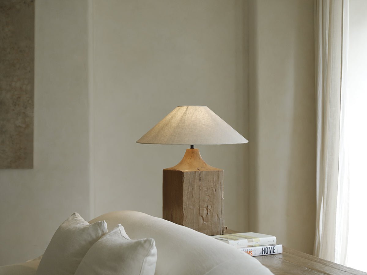 Wooden table lamp with linen shade on wooden table, cozy living room aesthetic, HOME book