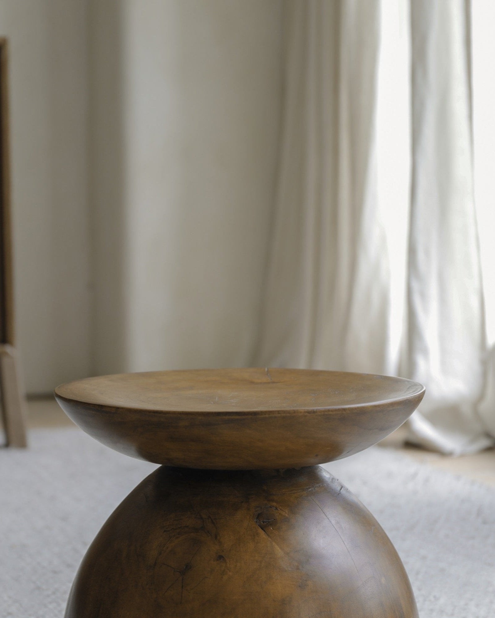 Sandglass table made from Samanea saman wood, hourglass design, minimalist living room decor.